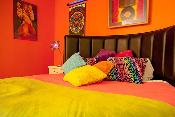 60's Bungalow bedroom with black lights and retro memorabilia